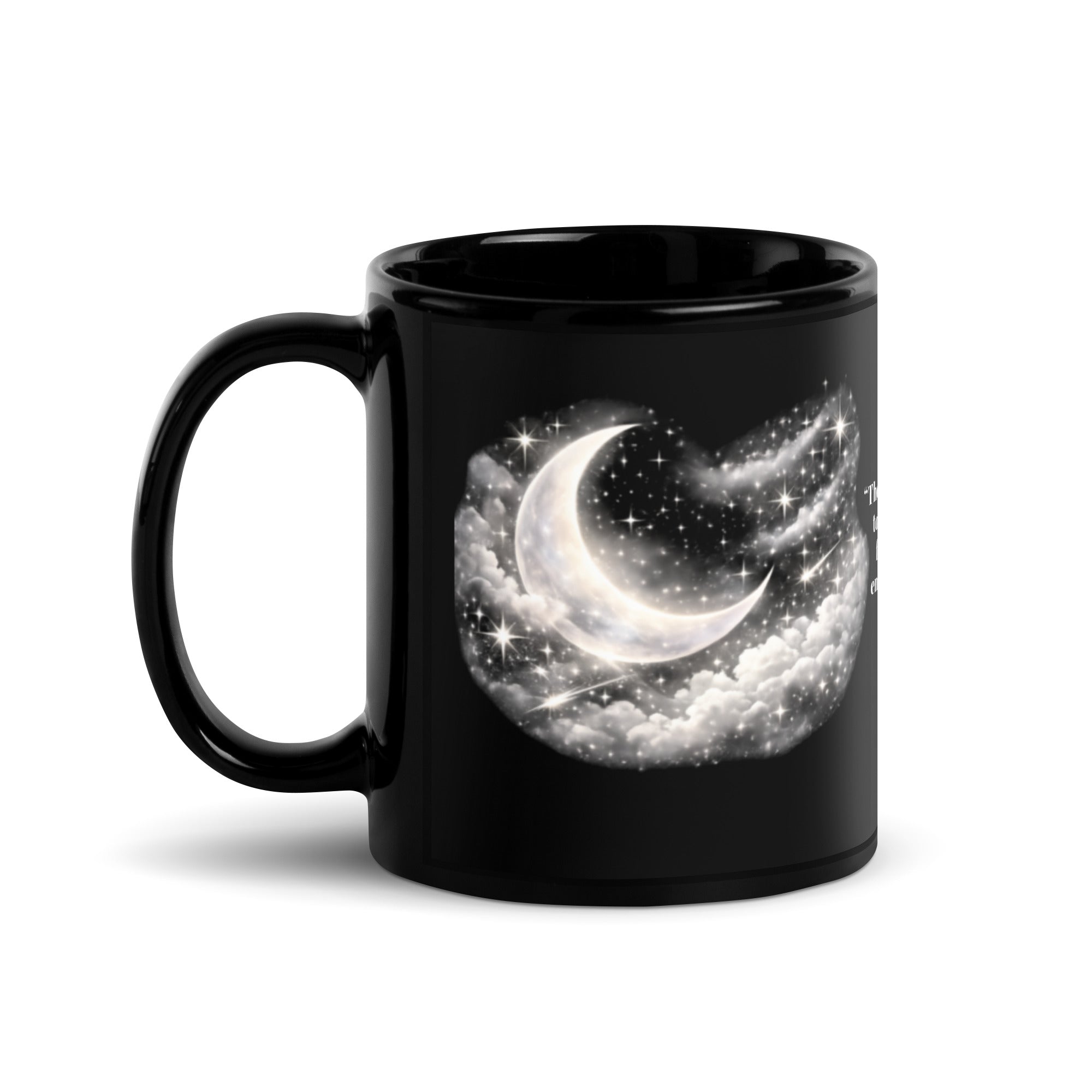 black ceramic mug featuring a dreamy silver crescent moon surrounded by glowing stars and soft clouds against the dark background. 