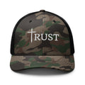 Camouflage cap with 'TRUST' and a cross on a white background