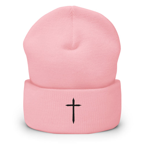pink cuffed beanie with black cross embroidered on the front 