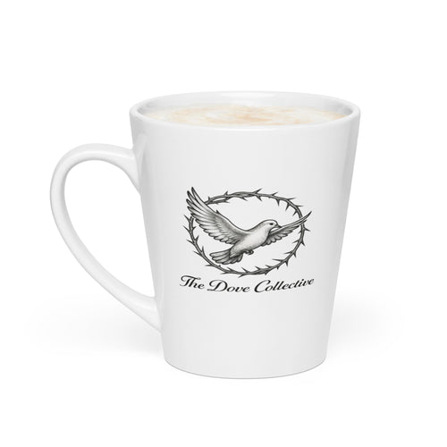 white ceramic Christian mug with a grayscale illustration of a flying dove encircled by a crown of thorn, with the words "The Dove Collective" in script beneath the design, shown against a plain white background.