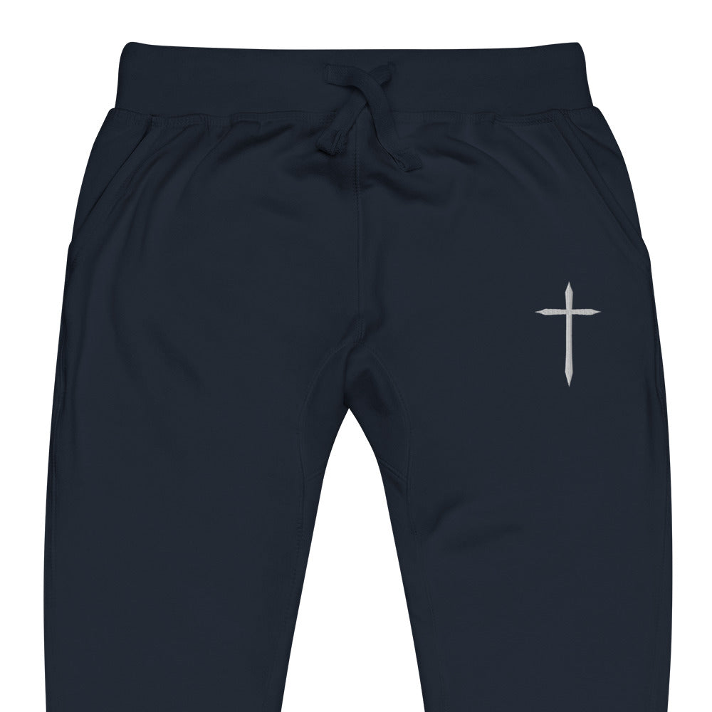 Black pants with a white cross logo on a white background