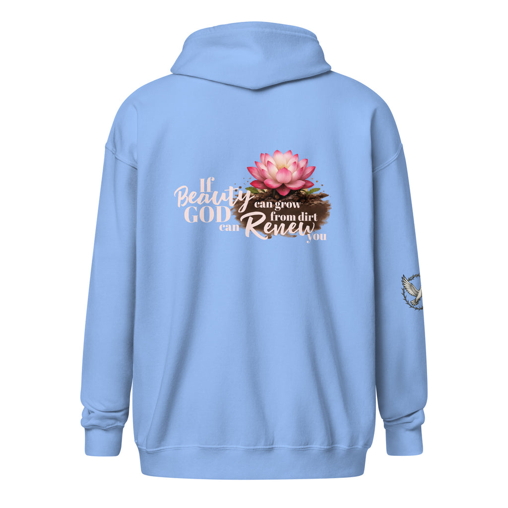 carolina blue hooded sweatshirt from the back, featuring a colorful pink lotus flower growing out of brown soil. Next to the flower is white and beige script text that reads, "If beauty can grow from dirt, God can renew you." There is also a small white dove on the right sleeve. 