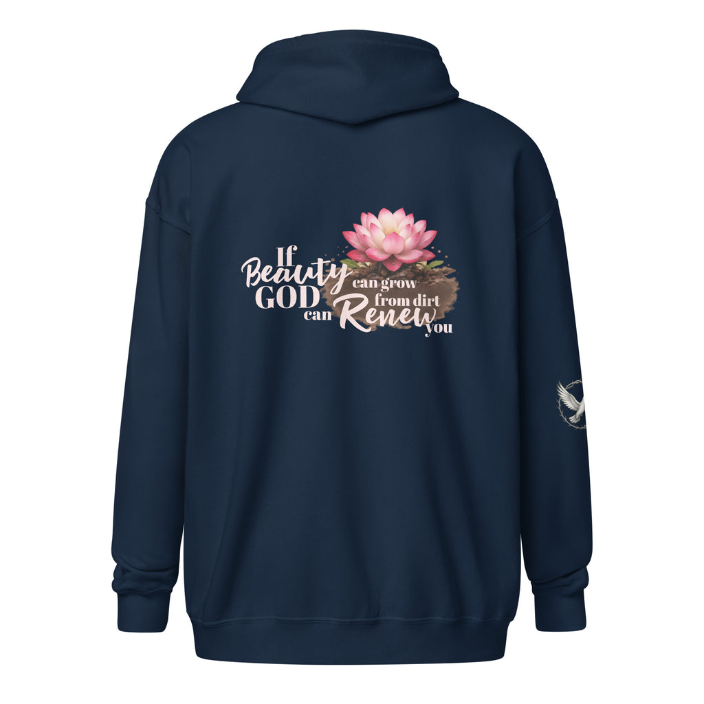 navy hooded sweatshirt from the back, featuring a colorful pink lotus flower growing out of brown soil. Next to the flower is white and beige script text that reads, "If beauty can grow from dirt, God can renew you." There is also a small white dove on the right sleeve. 