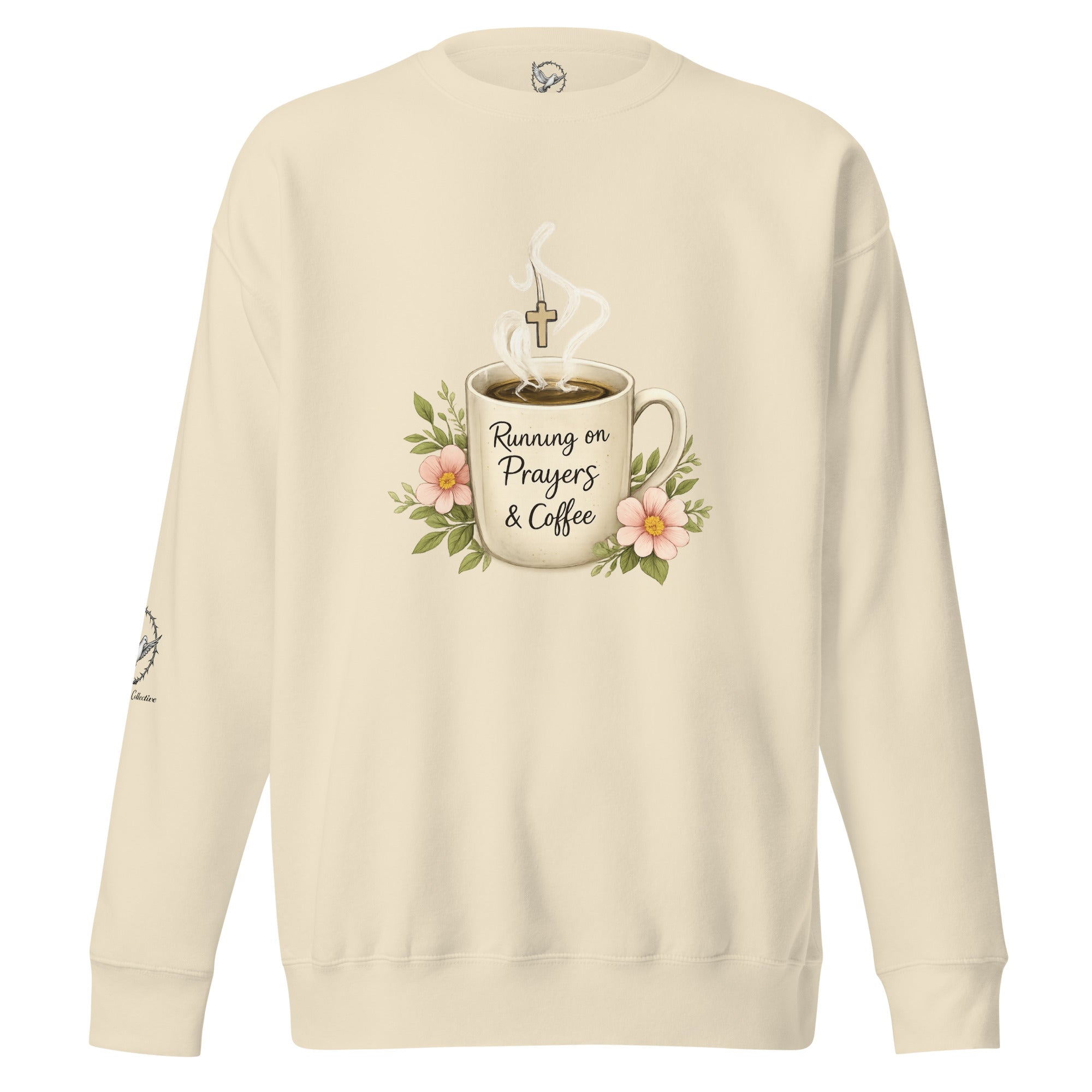 bone-colored sweatshirt with a coffee cup with words that read, "Running on prayers and coffee" featuring steam rising out of cup with a cross hanging off the steam. 