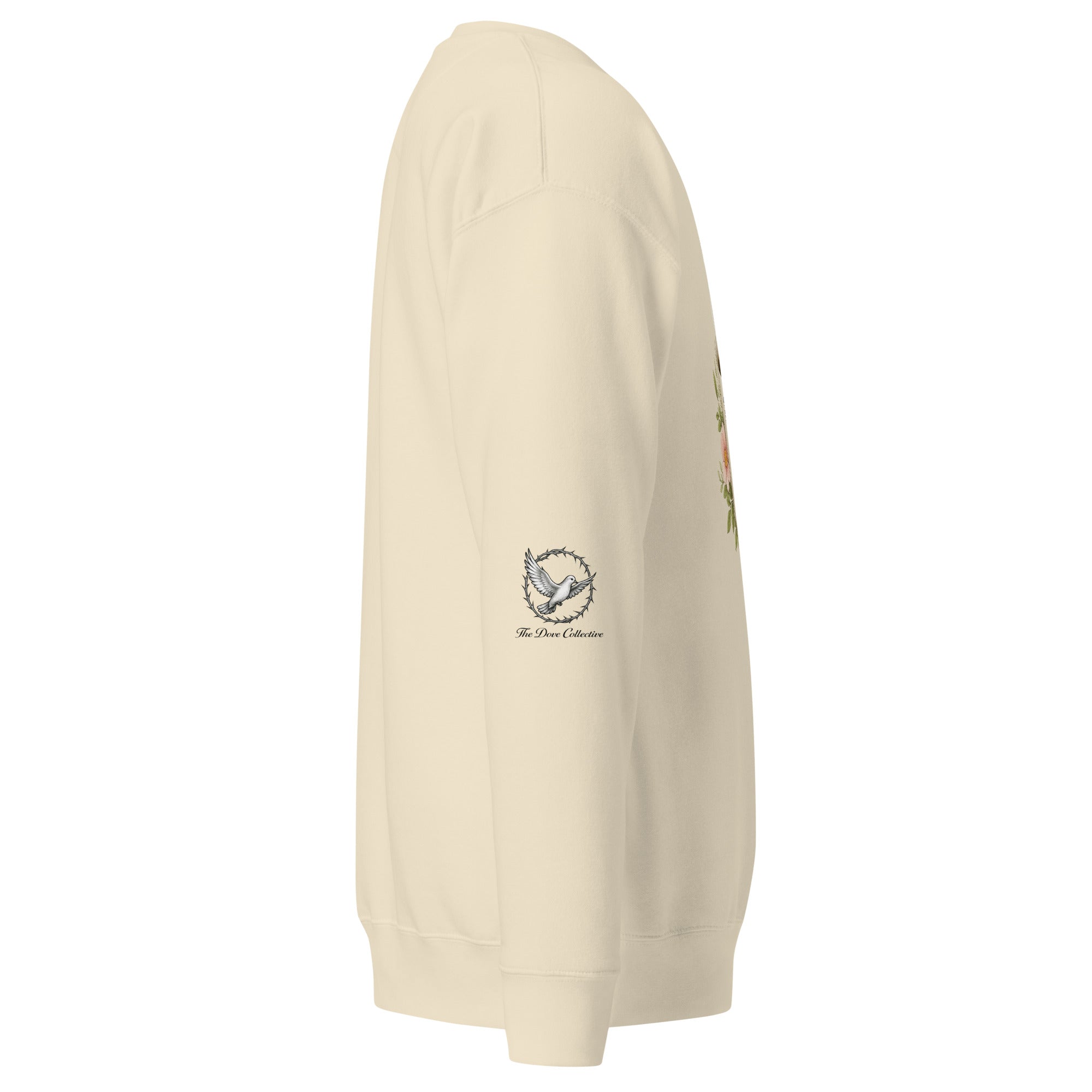bone-colored sweatshirt showing the right sleeve with a dove encircled by a crown of thorns. 