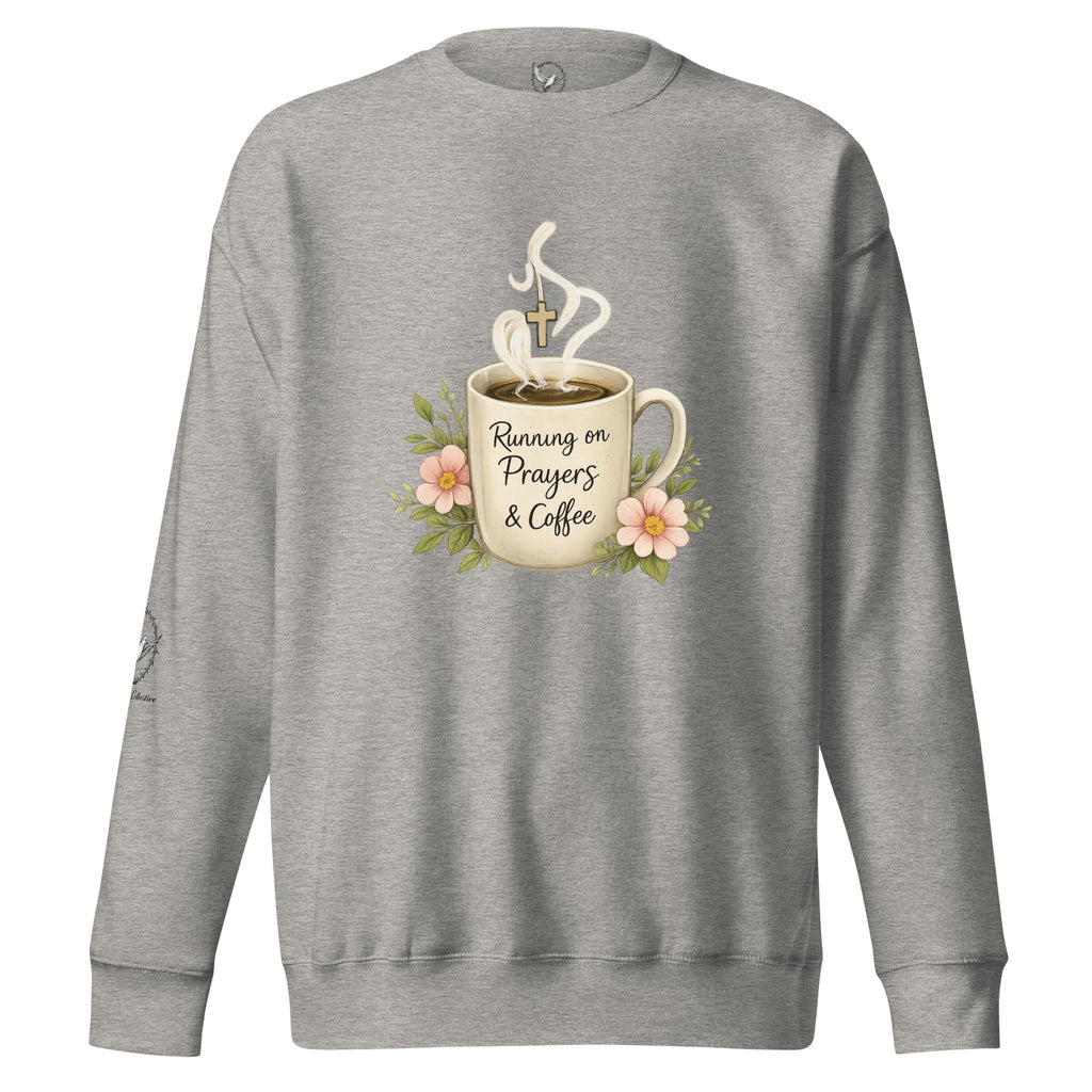 carbon grey sweatshirt with a coffee cup with words that read, "Running on prayers and coffee" featuring steam rising out of cup with a cross hanging off the steam.