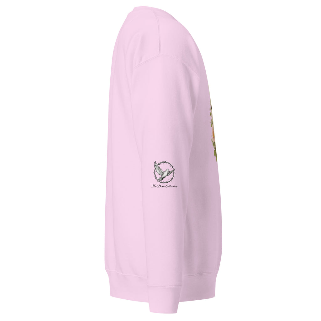 lavender sweatshirt showing the right sleeve with a dove encircled by a crown of thorns. 