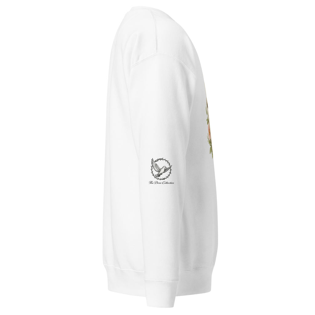white sweatshirt showing the right sleeve with a dove encircled by a crown of thorns. 