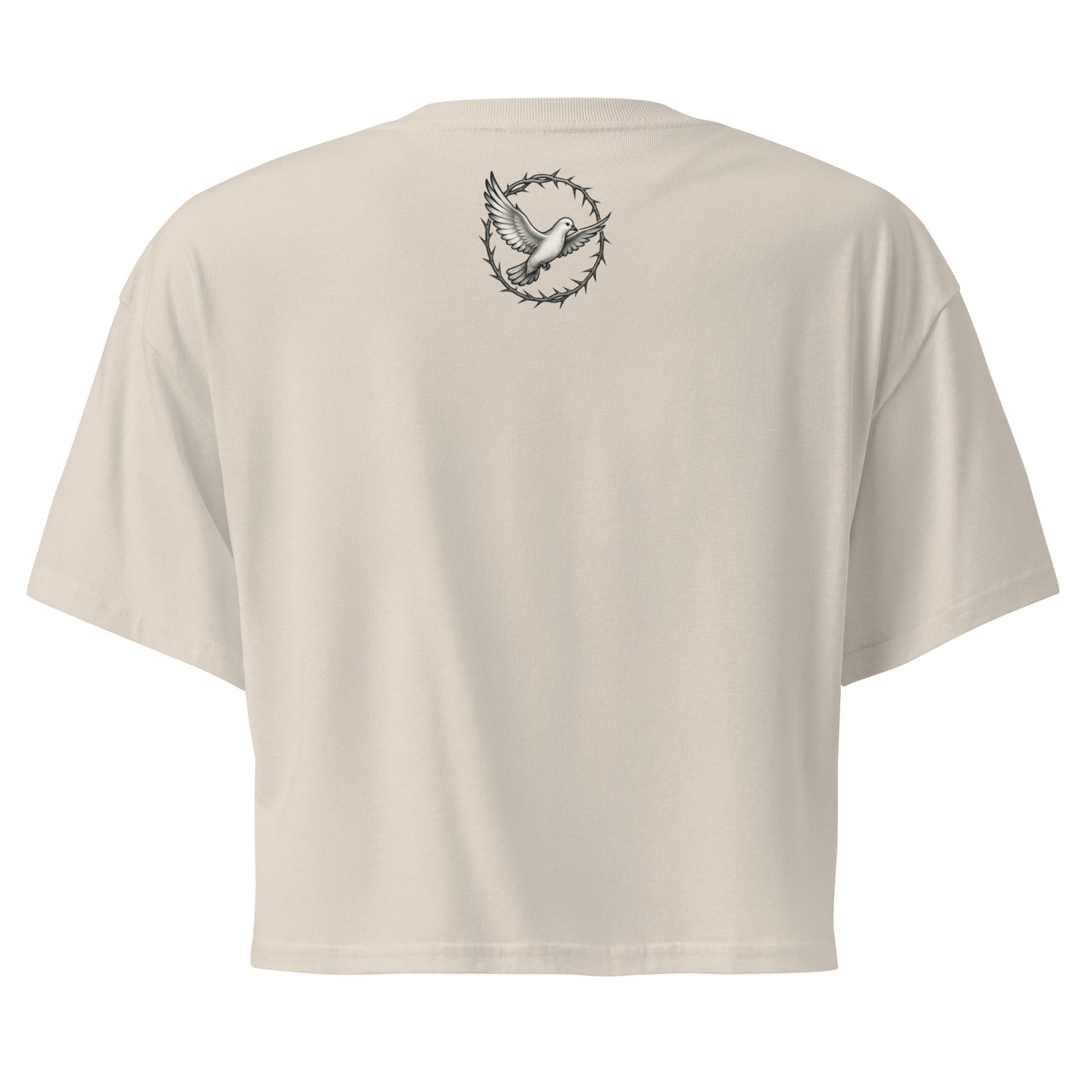  back of a bone-colored cropped Christian t-shirt featuring a small white dove centered between the shoulders surrounded by a circular crown of thorns design. 