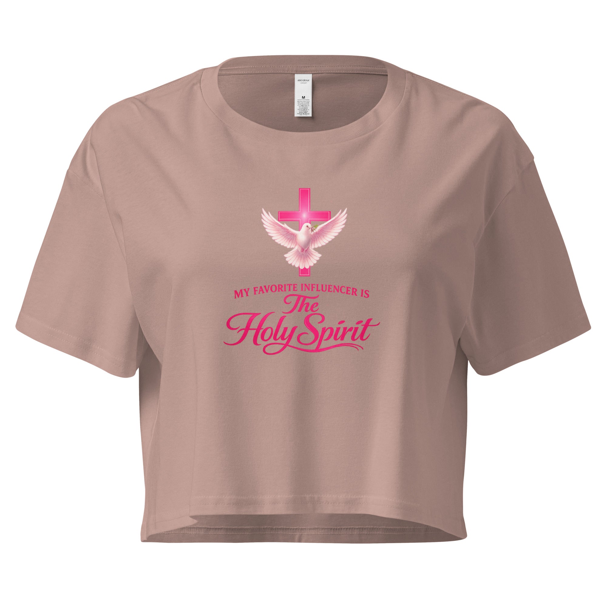 hazy pink cropped Christian t-shirt with a pink cross and white dove graphic, featuring the phrase "My favorite influencer is The Holy Spirit" in pink lettering across the front.