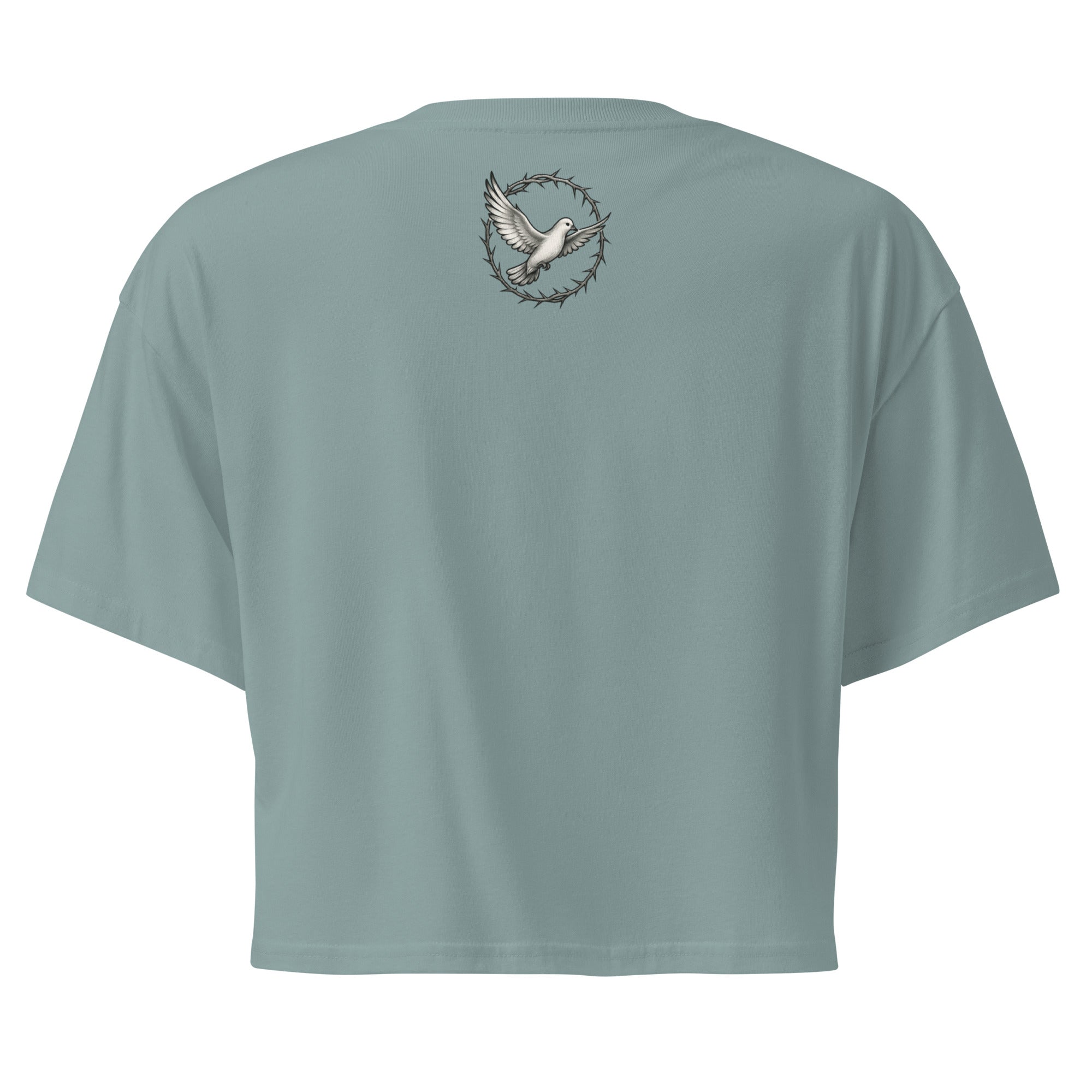 back of a mineral green cropped Christian t-shirt featuring a small white dove centered between the shoulders surrounded by a circular crown of thorns design.