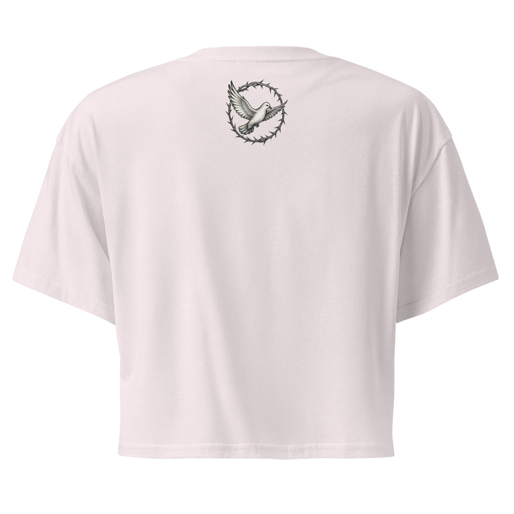 back of an orchid pink cropped Christian t-shirt featuring a small white dove centered between the shoulders surrounded by a circular crown of thorns design.